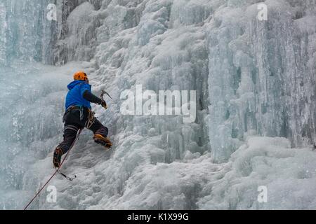 Ice climbing in Serrai of Sottoguda, Veneto, Belluno, Italy. The Cathedral, Dolomites Stock Photo