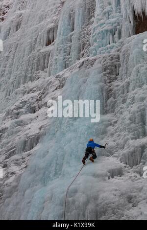 Ice climbing in Serrai of Sottoguda, Veneto, Belluno, Italy. The Cathedral, Dolomites Stock Photo