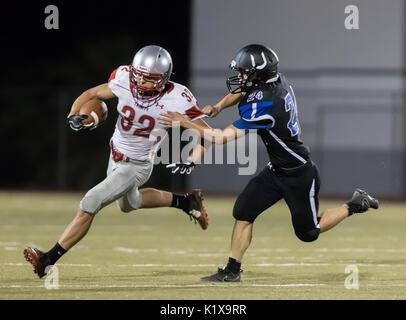 Football action with Trinity vs. University Prep High School in Redding, California. Stock Photo