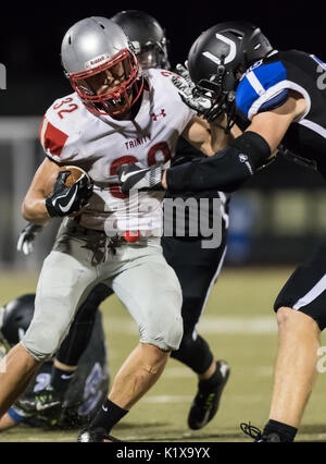 Football action with Trinity vs. University Prep High School in Redding, California. Stock Photo