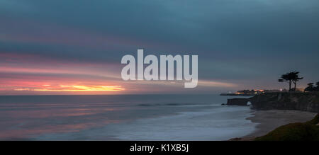 Long Exposure Photo of Rocky Cliff and Sand During Sunset Stock Photo