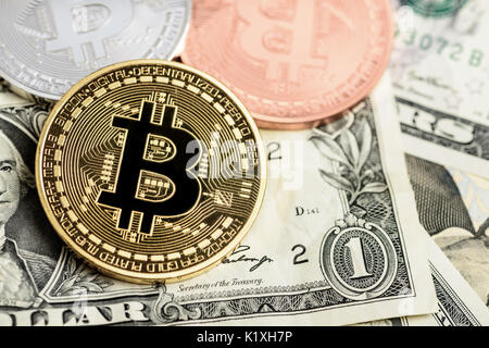 Golden bitcoin on money background. Bitcoin cryptocurrency concept Stock Photo