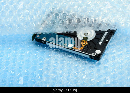Hard disk in bubble wrap package Stock Photo