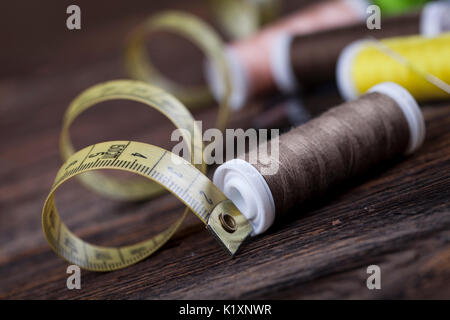 Sewing instruments, threads, needles, bobbins and materials. Studio photo Stock Photo