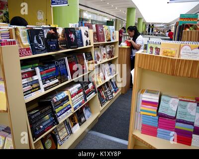 ANGONO, RIZAL, PHILIPPINES - AUGUST 26, 2017: Customers look at books on sale at a store in a shopping mall. Stock Photo