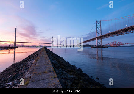 24/08/2017.  View at dusk of the new Queensferry Crossing bridge Forth Road bridge and Forth Rail bridge from Port Edgar South Queensferry. Stock Photo