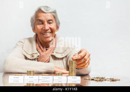 Senior woman budget with big savings for travel Stock Photo