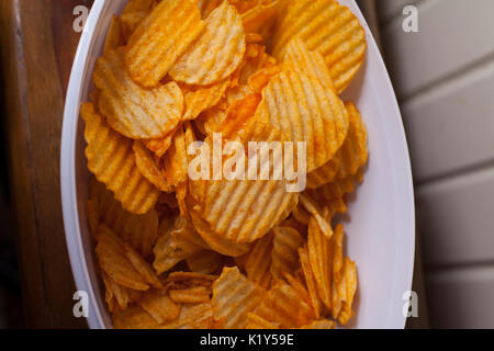 Close up of a bowl of flavored potato chips Stock Photo
