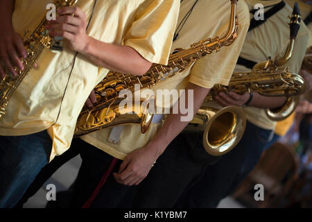 Saxophonists playing in a French marching band Stock Photo