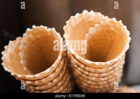 Empty ice-cream wafer cups ready to be filled with fresh cold sweet ice-cream to refresh one in a hot summer day. Stock Photo