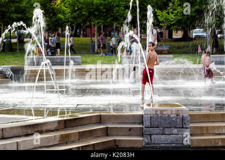 Children play in the water feature 'Splashville' in Asheville, North Carolina USA Stock Photo