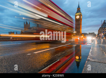 Light traces, double-deck bus, Westminster Bridge, Palace of Westminster, Houses of Parliament with reflection, Big Ben Stock Photo