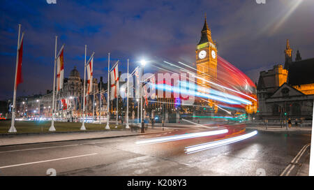 Light traces, double-deck bus, Westminster Bridge, Palace of Westminster, Houses of Parliament with reflection, Big Ben Stock Photo