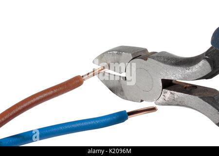 Trimming a live conductor / wire with side cutters / diagonal pliers isolated on a white background Stock Photo