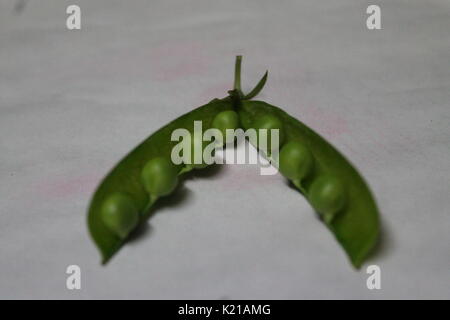 young sweet green color peas in pod prepare for cooking Stock Photo