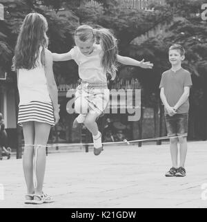 Energetic four friends playing game Stock Photo - Alamy