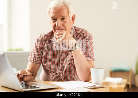 Senior Man Working  From Home Stock Photo
