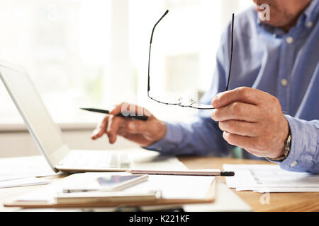 Senior Man Using Laptop at Home Closeup Stock Photo