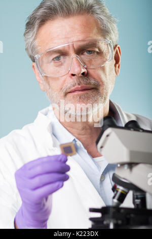 Senior life science research researching in modern scientific laboratory. Stock Photo