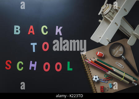 Flat lay of accessories decoration back to school or education concept.Mix variety object on the modern blackboard background.Different sign items of  Stock Photo