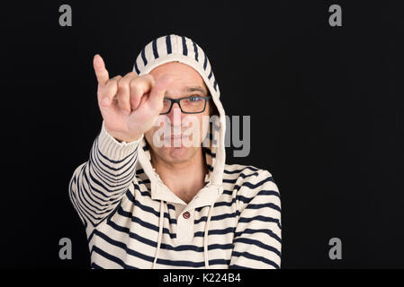attractive candid european middle-aged male in hooded sweater wi Stock Photo