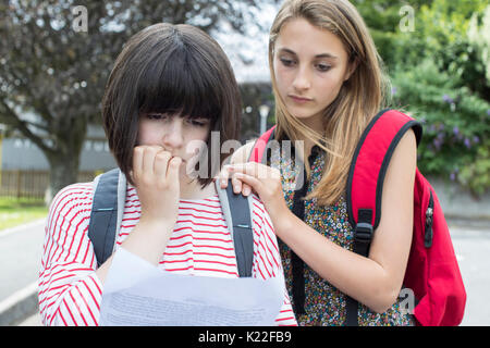 Teenage Girl Consoles Friend Over Bad Exam Result Stock Photo