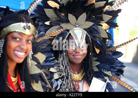 Thousands of revellers and spectators enjoy this year's Notting Hill Carnival with a colourful procession. Stock Photo