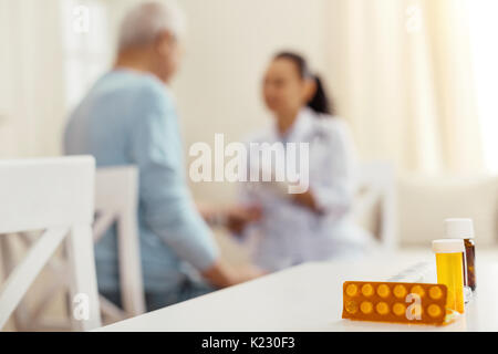 Selective focus of different pills standing on the table Stock Photo