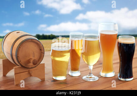 different types of beer in glasses on table Stock Photo