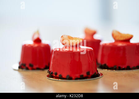 strawberry mirror glaze cakes at pastry shop Stock Photo