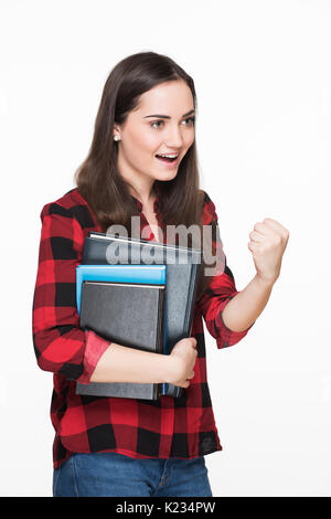 Attractive female student celebrating success. Student cheering. Education concept on white background Stock Photo