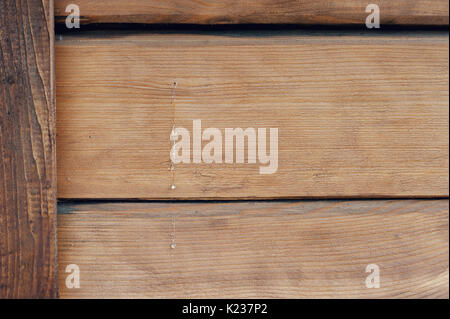 Texture of wood with flowable resin on the wall of a house made of wood Stock Photo