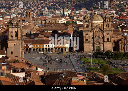 Iglesia de la Compania, people in Plaza de Armas, and terracotta roofs, Cusco, Peru, South America Stock Photo