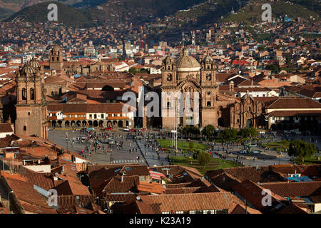 Iglesia de la Compania, people in Plaza de Armas, and terracotta roofs, Cusco, Peru, South America Stock Photo