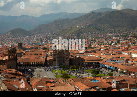 Iglesia de la Compania, people in Plaza de Armas, and terracotta roofs, Cusco, Peru, South America Stock Photo