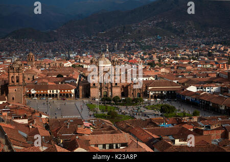 Iglesia de la Compania, people in Plaza de Armas, and terracotta roofs, Cusco, Peru, South America Stock Photo