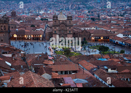 Iglesia de la Compania, people in Plaza de Armas, and terracotta roofs, Cusco, Peru, South America Stock Photo