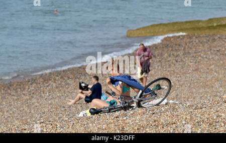 Brighton, UK. 28th Aug, 2017. Swimmers enjoy the beautiful hot sunny weather on Brighton and Hove seafront today as temperatures are expected to reach as high as 30 degrees in some parts of the south east which is a record for the late August Bank Holiday Credit: Simon Dack/Alamy Live News