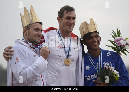Winners of the Men C1 1000 m final race SEBASTIAN BRENDEL (center, Germany, first place), MARTIN FUKSA (left, Czech, second place) and ISAQUIAS QUEIROZ DOS SANTOS (Brazil, third place), pose with medals during the 2017 ICF Canoe Sprint World Championships in Racice, Czech Republic, on August 26, 2017. (CTK Photo/Katerina Sulova) Stock Photo