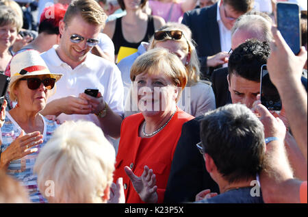 Bitterfeld-Wolfen, Germany. 29th Aug, 2017. German Chancellor Angela Merkel arrives at an election campaign event of the CDU in Bitterfeld-Wolfen, Germany, 29 August 2017. German general elections will be held on 24 September 2017. Credit: dpa picture alliance/Alamy Live News Stock Photo