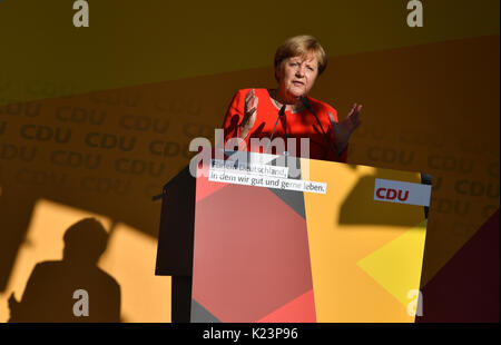 Bitterfeld-Wolfen, Germany. 29th Aug, 2017. German Chancellor Angela Merkel speaks at an election campaign event of the CDU in Bitterfeld-Wolfen, Germany, 29 August 2017. German general elections will be held on 24 September 2017. Credit: dpa picture alliance/Alamy Live News Stock Photo