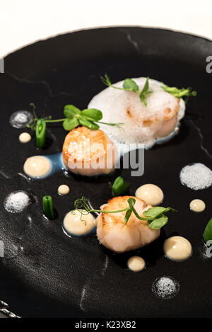 Grilled scallops with truffle ans culiflower sauce Stock Photo