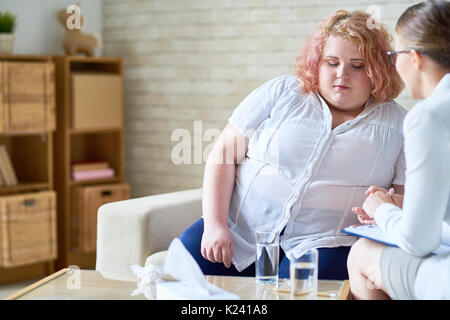 Obese Young Woman Talking to  Psychiatrist Stock Photo