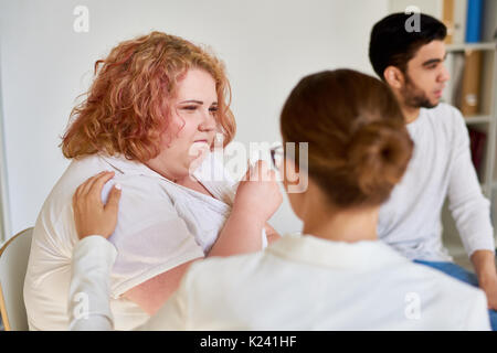 Obese Young Woman Crying in Support Group Session Stock Photo