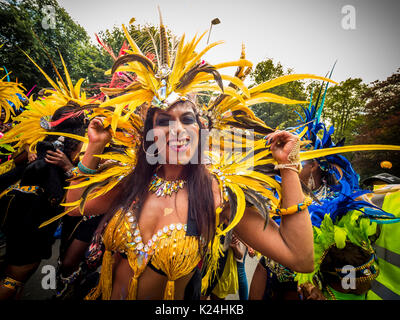 Leeds, UK. 28th August, 2017.  The 50th Leeds West Indian Carnival at Potternewton Park. The carnival was the first in the UK, in 1967, to incorporate all three essential elements of authentic West Indian carnival – costumes, music and a masquerade procession – it is Europe’s longest running Caribbean carnival parade. The event incorporates a colourful procession through the streets, a live music stage and street food and is geared towards all ages and cultures. Photo Bailey-Cooper Photography/Alamy Live News Stock Photo