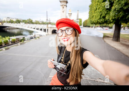 Woman in red traveling Paris Stock Photo