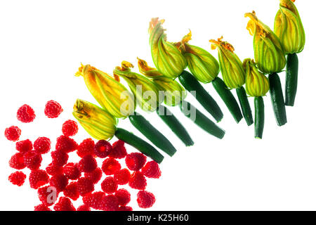Fresh zucchini flowers top view isolated on white And raspberry Stock Photo