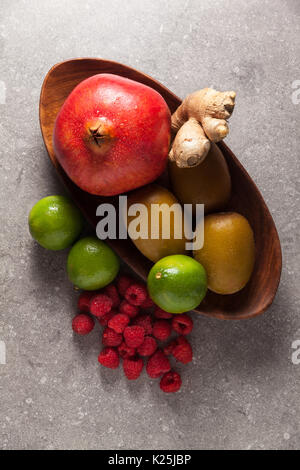 Colorful fruits  background on grey stone background Stock Photo