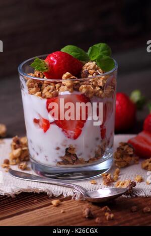 Granola cereals, joghurt and fresh and sweet strawberries in a glass Stock Photo