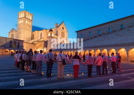 Europe,Italy,Umbria, Perugia district,Assisi Moment of prayer in the square of the Church of Saint Francis of Assisi Stock Photo
